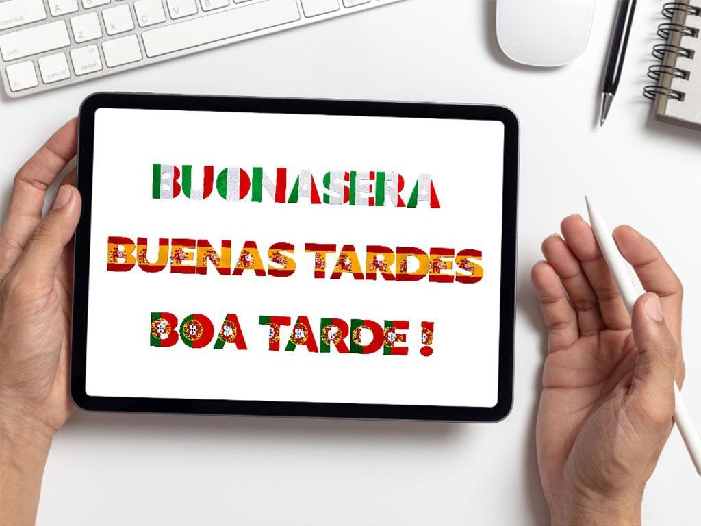Ein Tablet zeigt die Begrüßung ‚Guten Abend‘ auf Italienisch, Spanisch und Portugiesisch